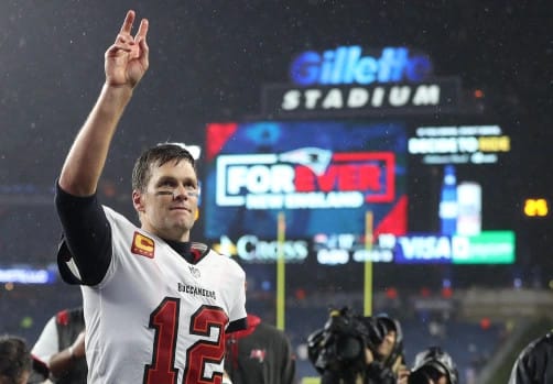 Tampa Bay Buccaneers quarterback Tom Brady waves to fans chanting”Brady, Brady” as he leaves the field after the game the game at Gillette Stadium on October 3, 2021 in Foxboro, MA